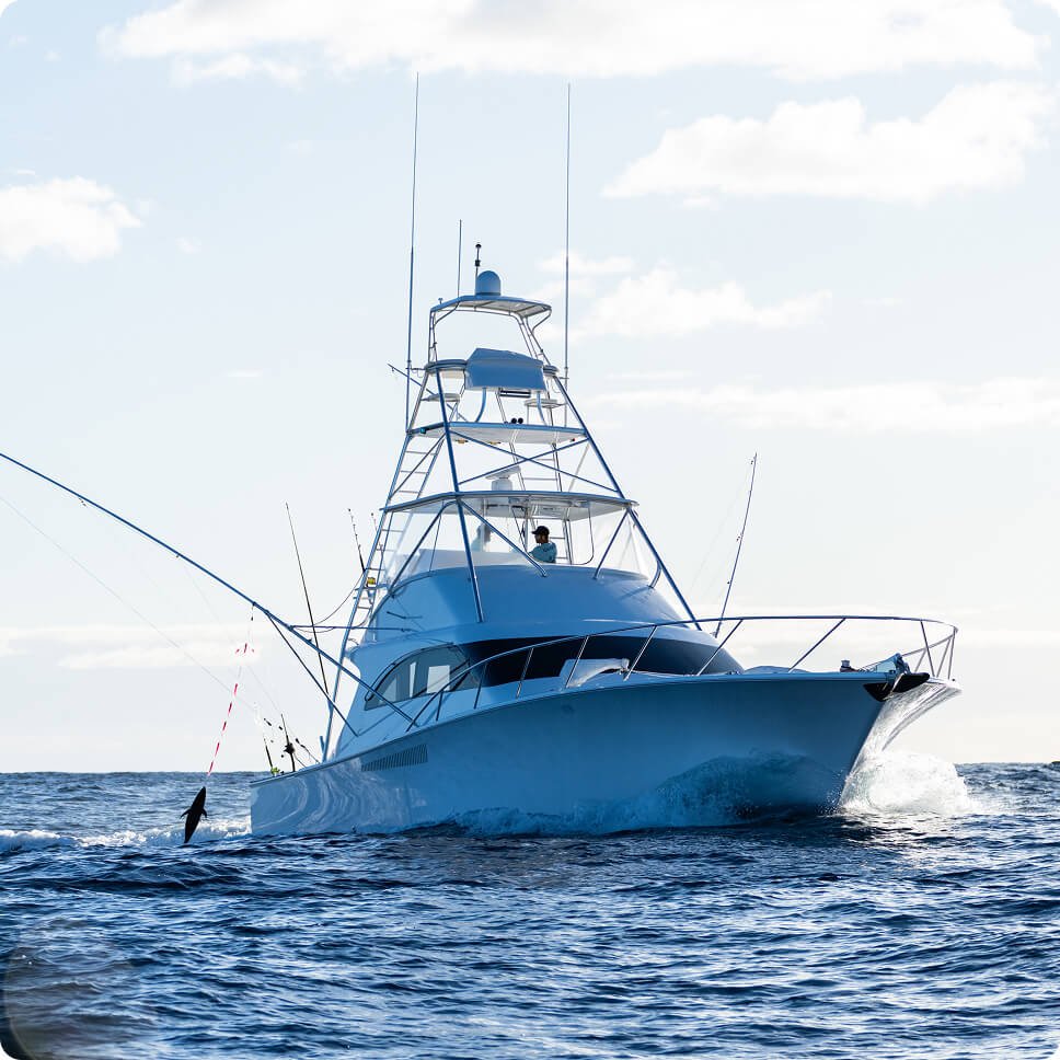 Sport fishing boat cruising on open water.